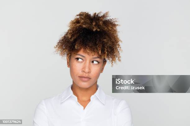 Portrait Of Pensive Businesswoman Looking Away Stock Photo - Download Image Now - One Woman Only, Problems, Uncertainty