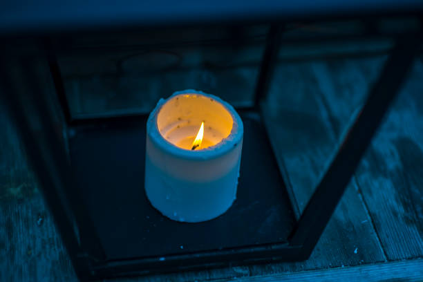 istock Candle light in the darkness and candle holder 1001381738
