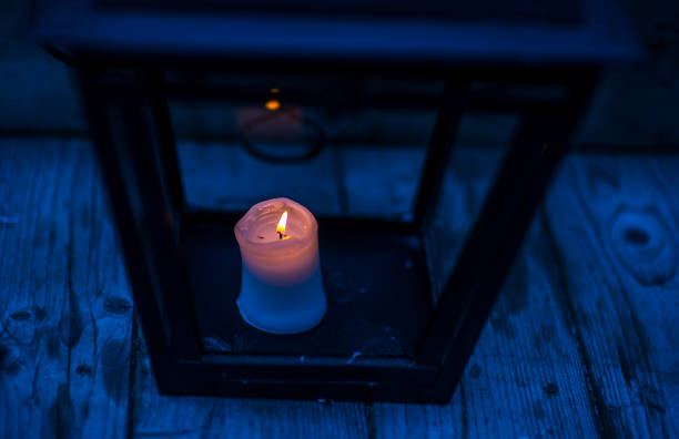 istock Candle light in the darkness and candle holder 1001381788
