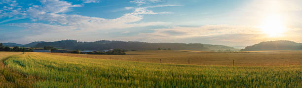 istock Sunrise over village and agricultural fields 1001389548
