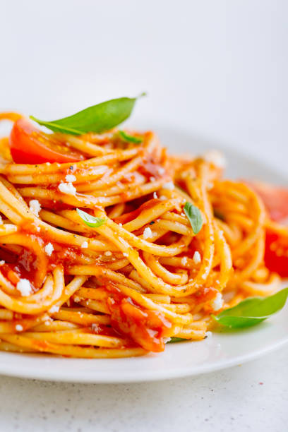 istock Italian pasta with tomato sauce on plate 1001393818