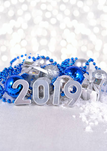 istock 2019 year silver figures and silvery and blue Christmas decorations 1001396438