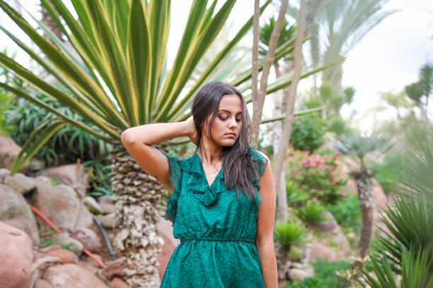 istock Chic girl in a long evening dress. 1001396530