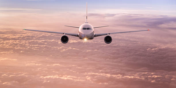 istock Commercial airplane flying above dramatic clouds 1001396980