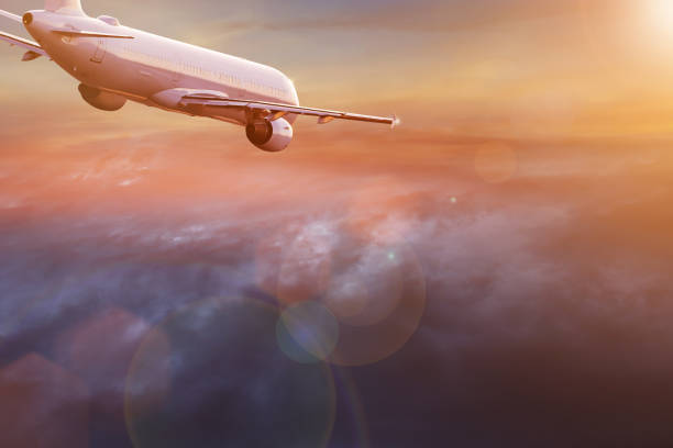 istock Commercial airplane flying above dramatic clouds 1001397320