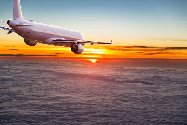 istock Commercial airplane flying above dramatic clouds 1001397424