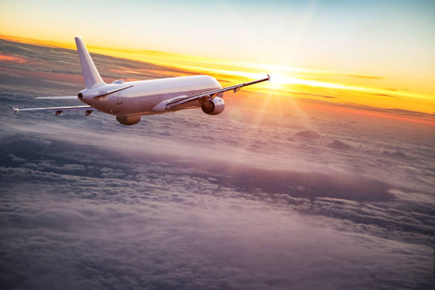 istock Commercial airplane flying above dramatic clouds 1001397456
