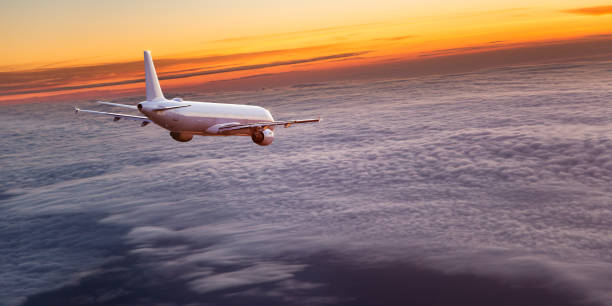 istock Commercial airplane flying above dramatic clouds 1001397546