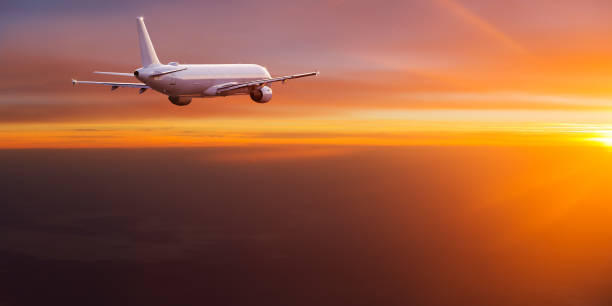 istock Commercial airplane flying above dramatic clouds 1001397572