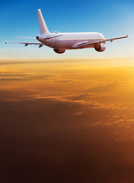 istock Commercial airplane flying above dramatic clouds 1001397688