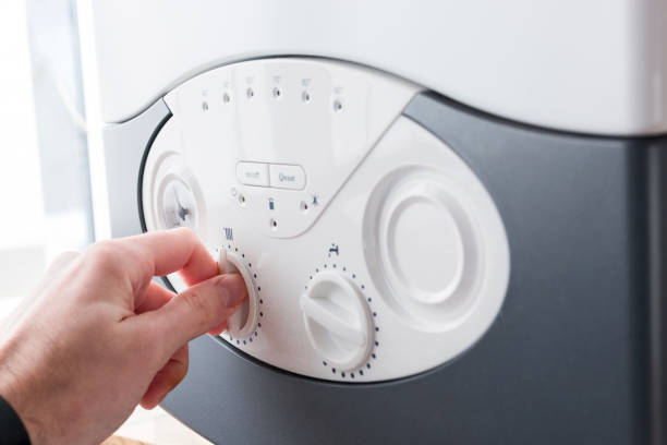 istock Hand Turning a Knob on Washing Machine Dashboard 1001397758