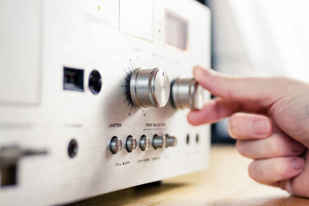 istock Hand Turning a Dial on a Vintage Hi-Fi Home Stereo 1001397778