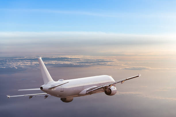 istock Commercial airplane flying above dramatic clouds 1001397998