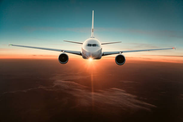 istock Commercial airplane flying above dramatic clouds 1001398072