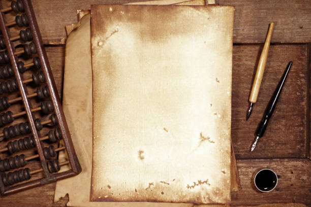 istock old paper on brown wood texture with pen and ink 1001398318