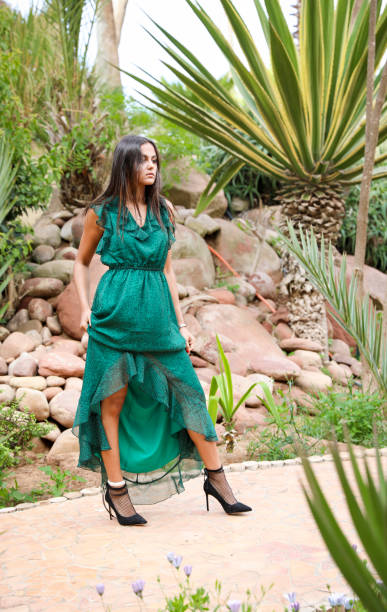 istock Chic girl in a long evening dress. 1001401238