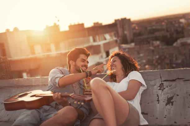 istock Couple at a rooftop party 1001401354