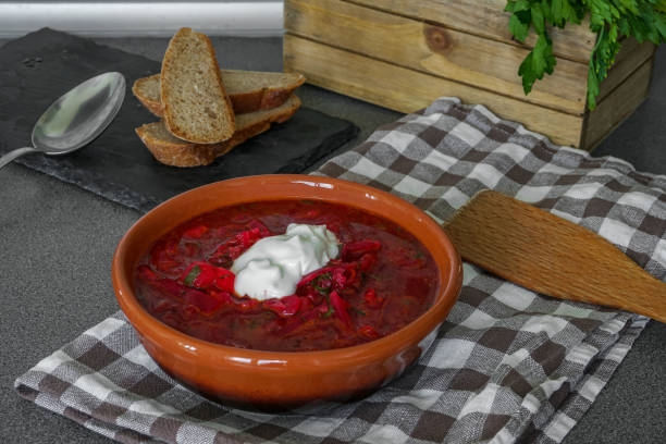 istock Delicious homemade borsch with sour cream. 1001404680