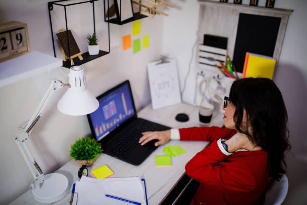 istock Tired young business woman with laptop computer 1001405218