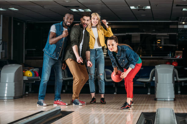 istock excited group of young friends playing bowling together 1001410152