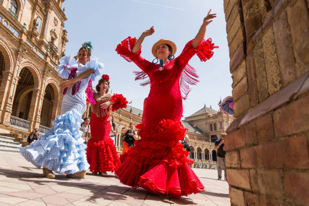 Young women dance flamenco on Plaza de Espana in Seville, Spain stock photo
