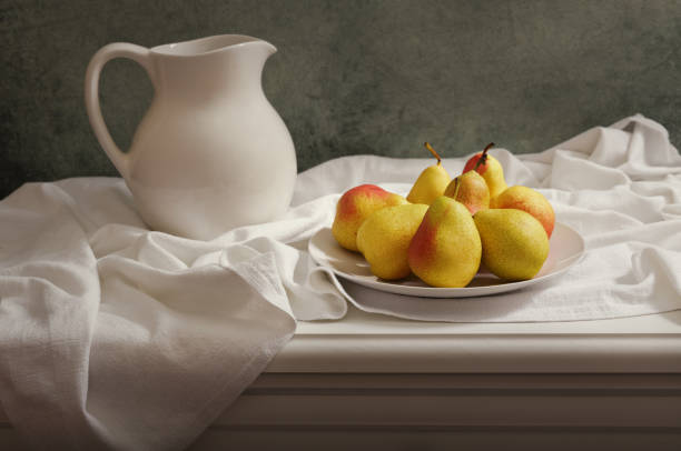 istock still life with pears on wooden table 1001414002