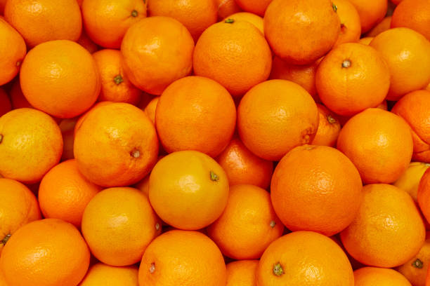 istock Orange background, Orange produce at market 1001419184