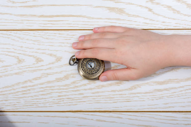 istock Retro style pocket watch in hand 1001422462