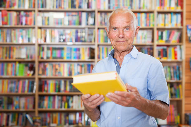 istock Happy elderly man in bookstore 1001426804