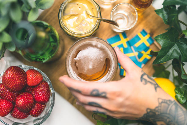 istock Lager beer at a Swedish midsummer dinner party 1001426868