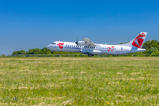 Czech Airline aircraft is landing at Boryspil airport, Ukraine, on green grass. Czech Airlines is the national airline of the Czech Republic, founded on 6 October 1923. In summer season, it flies to 50 destinations in Asia and Europe.