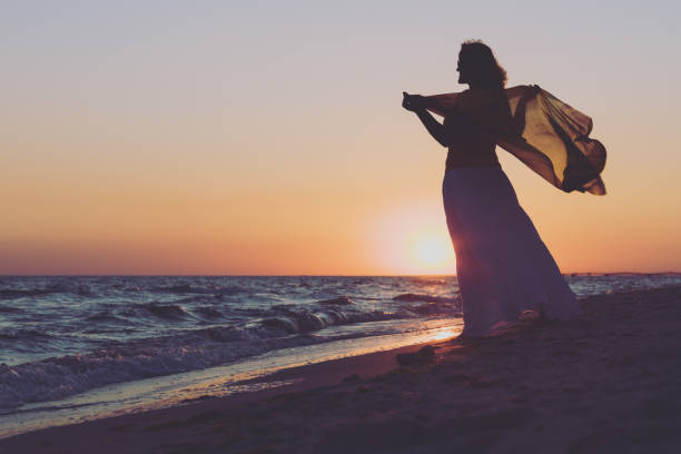 istock Walking on the seaside in the sunset time 1001434238