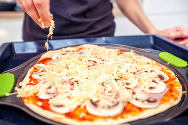 istock Woman is making a home pizza 1001438120