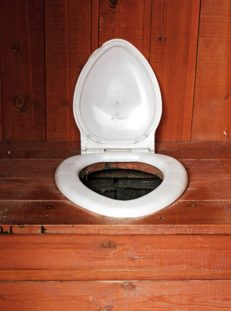 Country toilet at day Country wooden and plastic toilet at day outhouse interior stock pictures, royalty-free photos & images