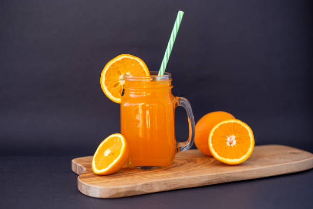 istock Fresh orange juice in the glass jar 1001442422