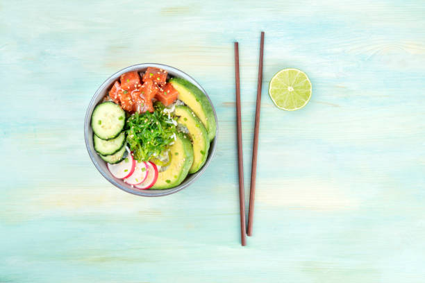 istock Hawaii tuna poke salad with lime, chopsticks, and copy space 1001469628