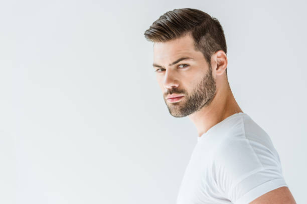 istock Stylish young brunette bearded man isolated on white background 1001473494