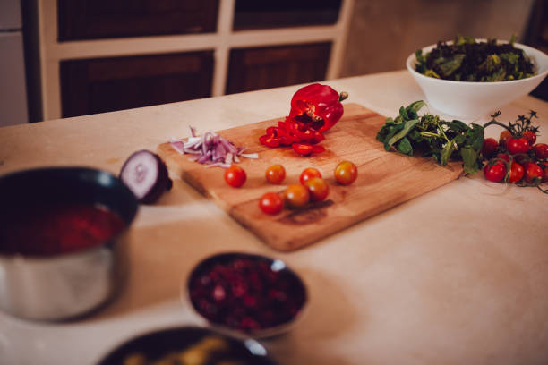 Freshly cut vegetables on cutting board for the preparation of salad and healthy Mediterranean meal