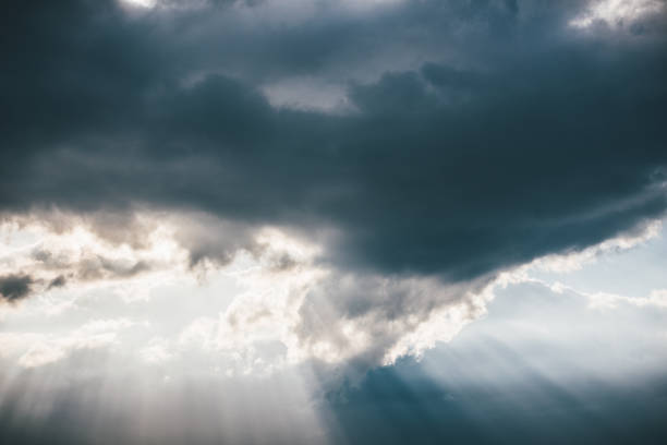 istock Sunbeam trough the stormcloud in the dusk 1001486426