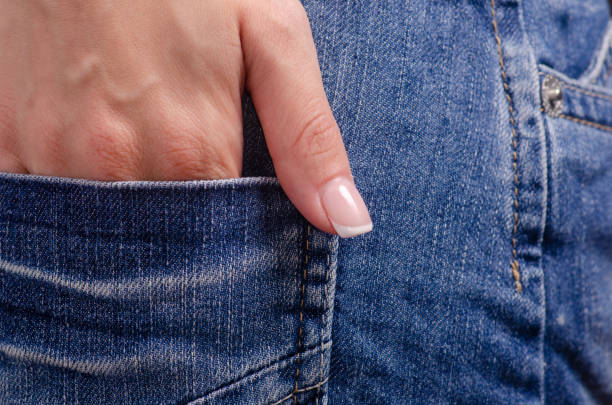 istock Woman in jeans pocket macro 1001490874