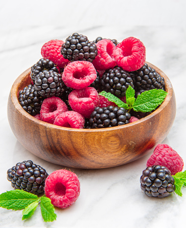 Wooden cup with fresh berries