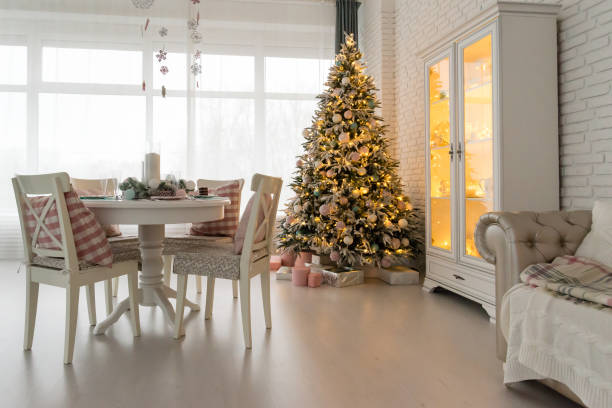 istock Beautiful Christmas decorated light living room with a Christmas 1001498068