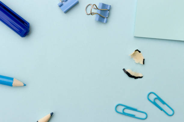 istock back to school or office styled concept, frame with blue school supplies on blue background 1001502940