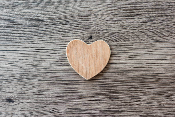 istock Wooden heart on a wooden background 1001505846