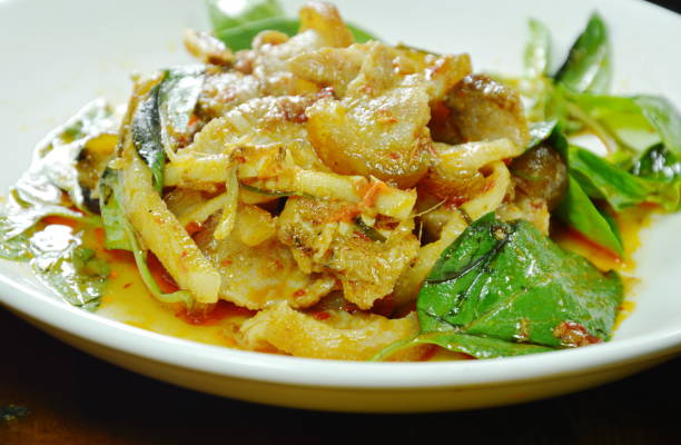 istock stir fried spicy wild boar and coconut shoot with red curry 1001510546