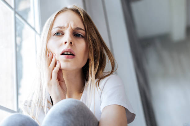 istock Preoccupied girl having a terrible toothache 1001515042