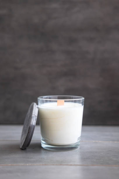 istock Concrete scented soy round candle on grey table 1001515496