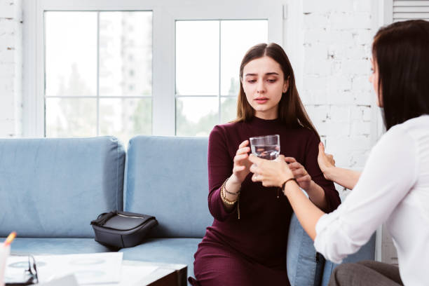 istock Young woman taking water while feeling worried 1001515526