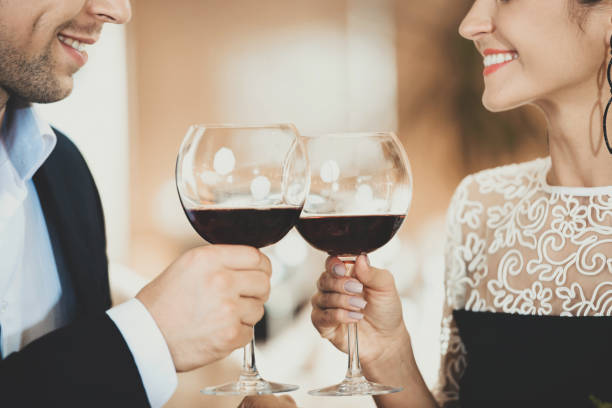 istock Young Couple in Love Drinking Wine Clink Glasses 1001525028