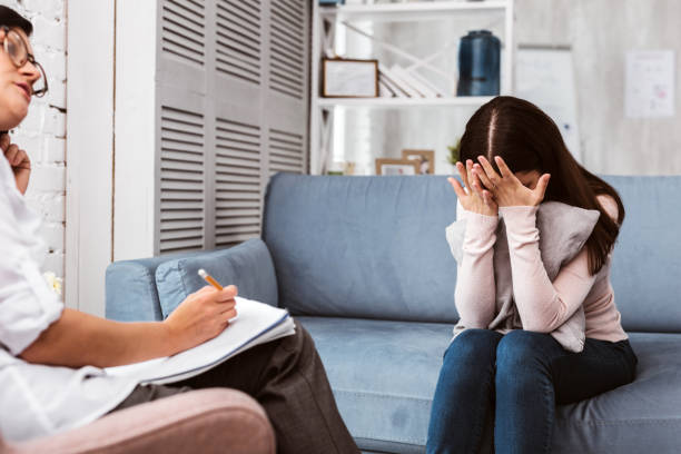 istock Young patient closing her eyes and talking about headaches 1001533576